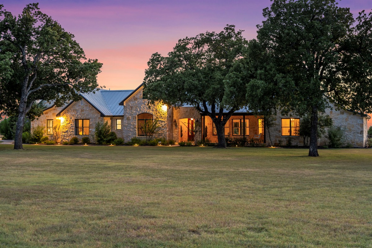 Twilight hues painting the sky over a peaceful home.