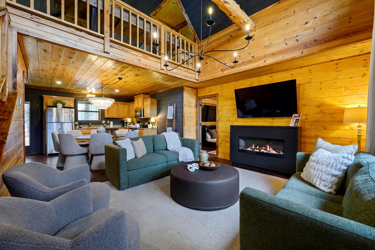 Living Room:
Open-concept living with plush seating, natural wood accents, and plenty of room to unwind. A comfortable space for movie nights, board games, or simply relaxing together.