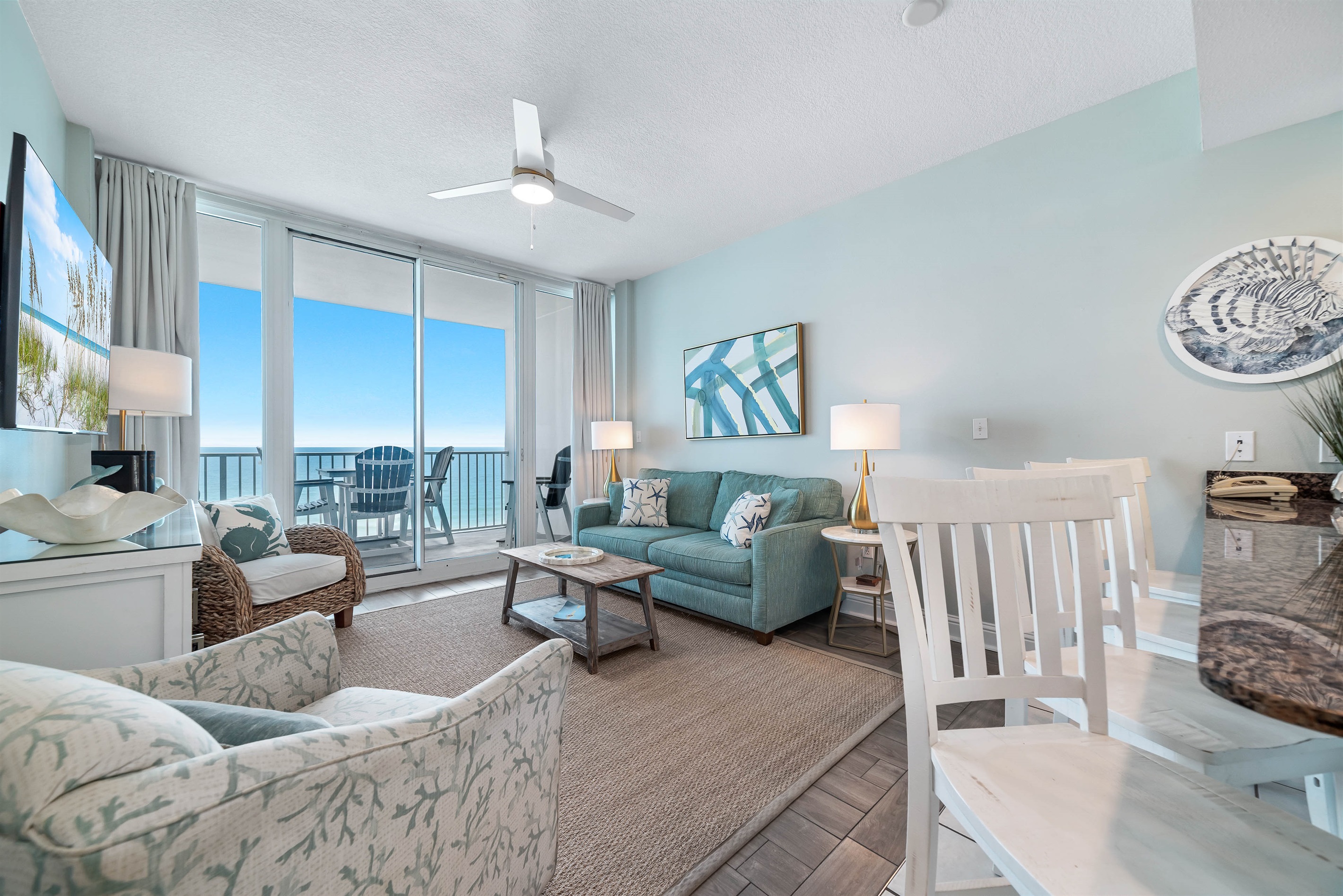 Experience the beauty of indoor-outdoor living with expansive sliding doors leading to a private balcony overlooking the ocean.