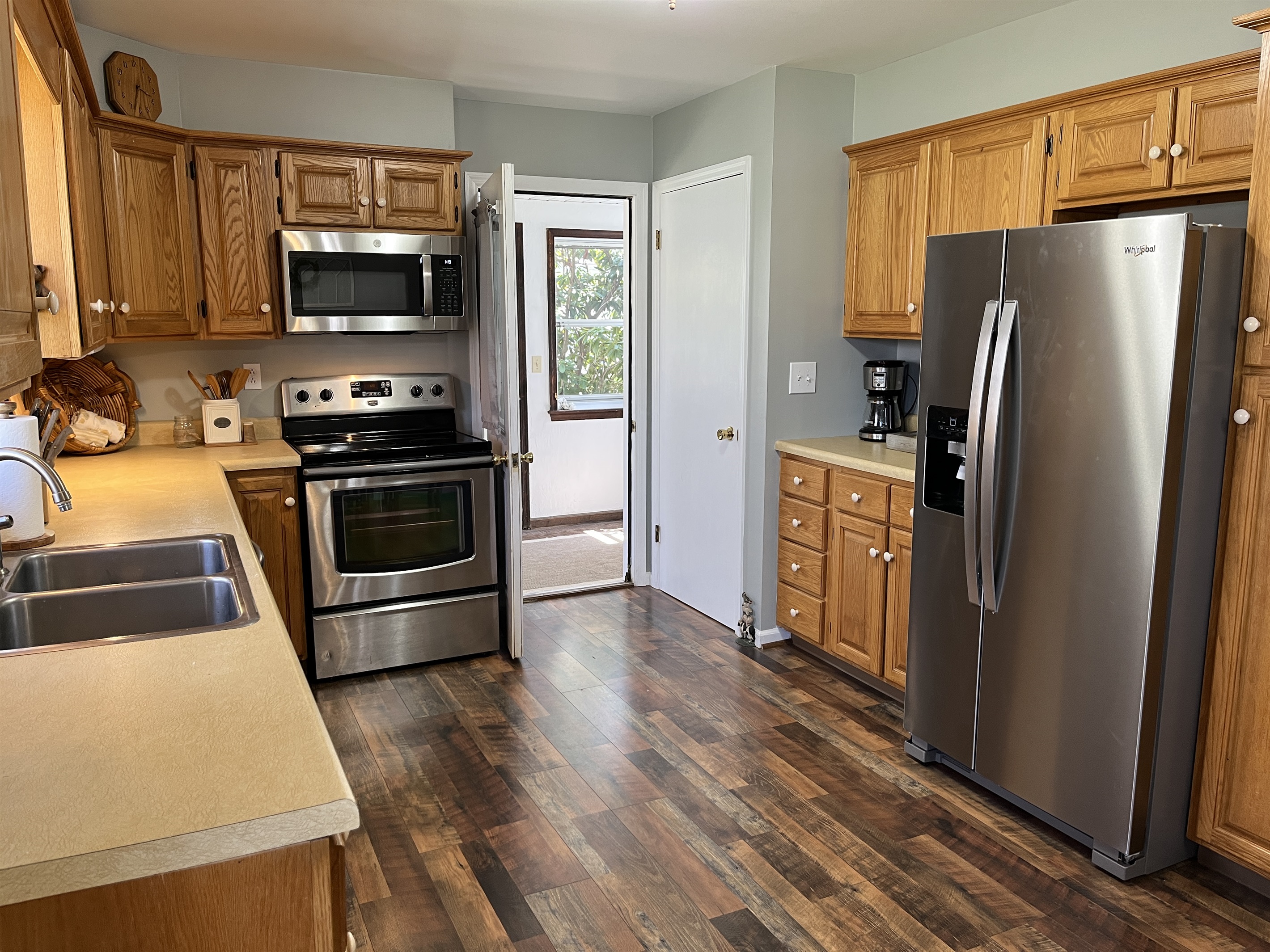 Updated kitchen leading to sun porch
