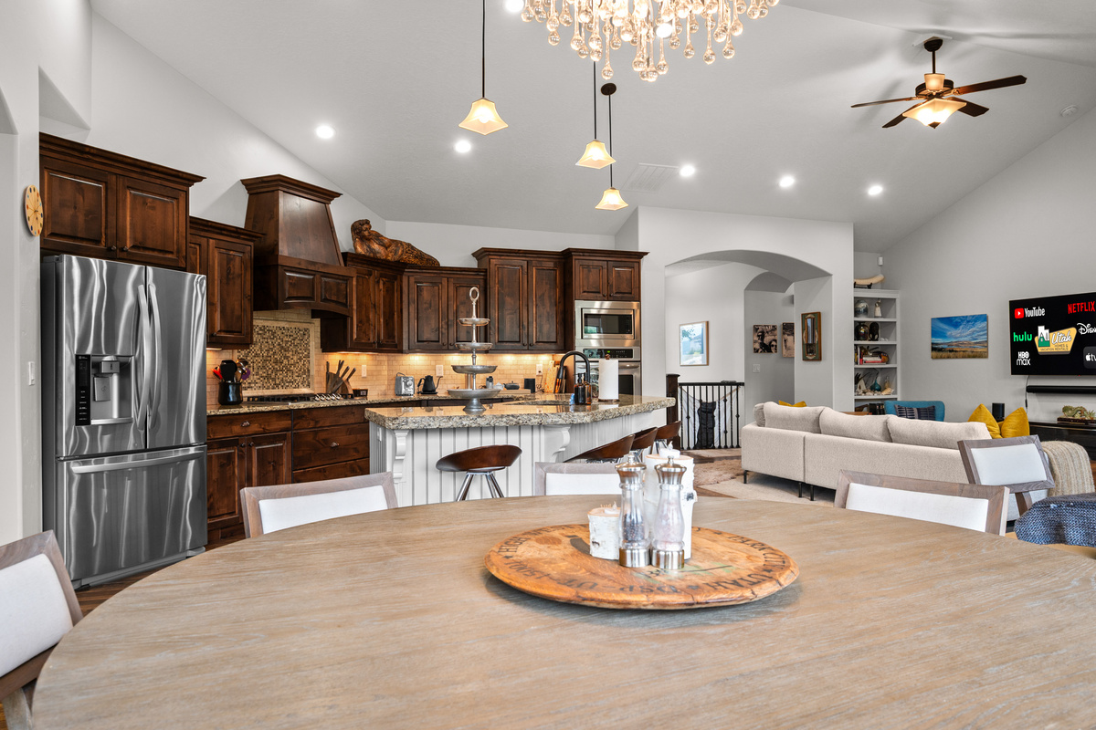 Dine, Gather, and Connect – The open dining area flows seamlessly into the gourmet kitchen and great room, creating the perfect setting for shared meals and lasting memories.
