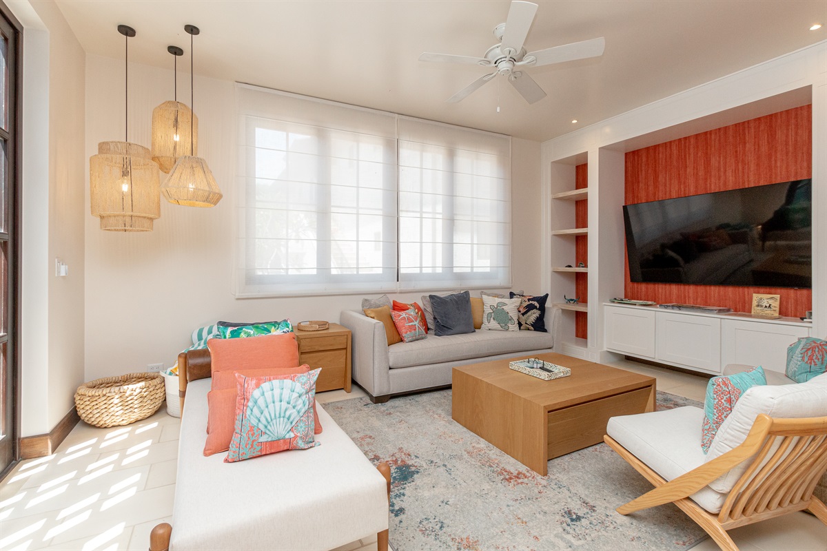 The large living room with smart TV is perfect for movie night with the family.