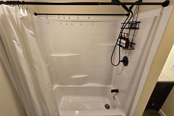 Downstairs bathroom - Shower/Tub combo. Extra rod and hooks for hanging wet swimsuits.