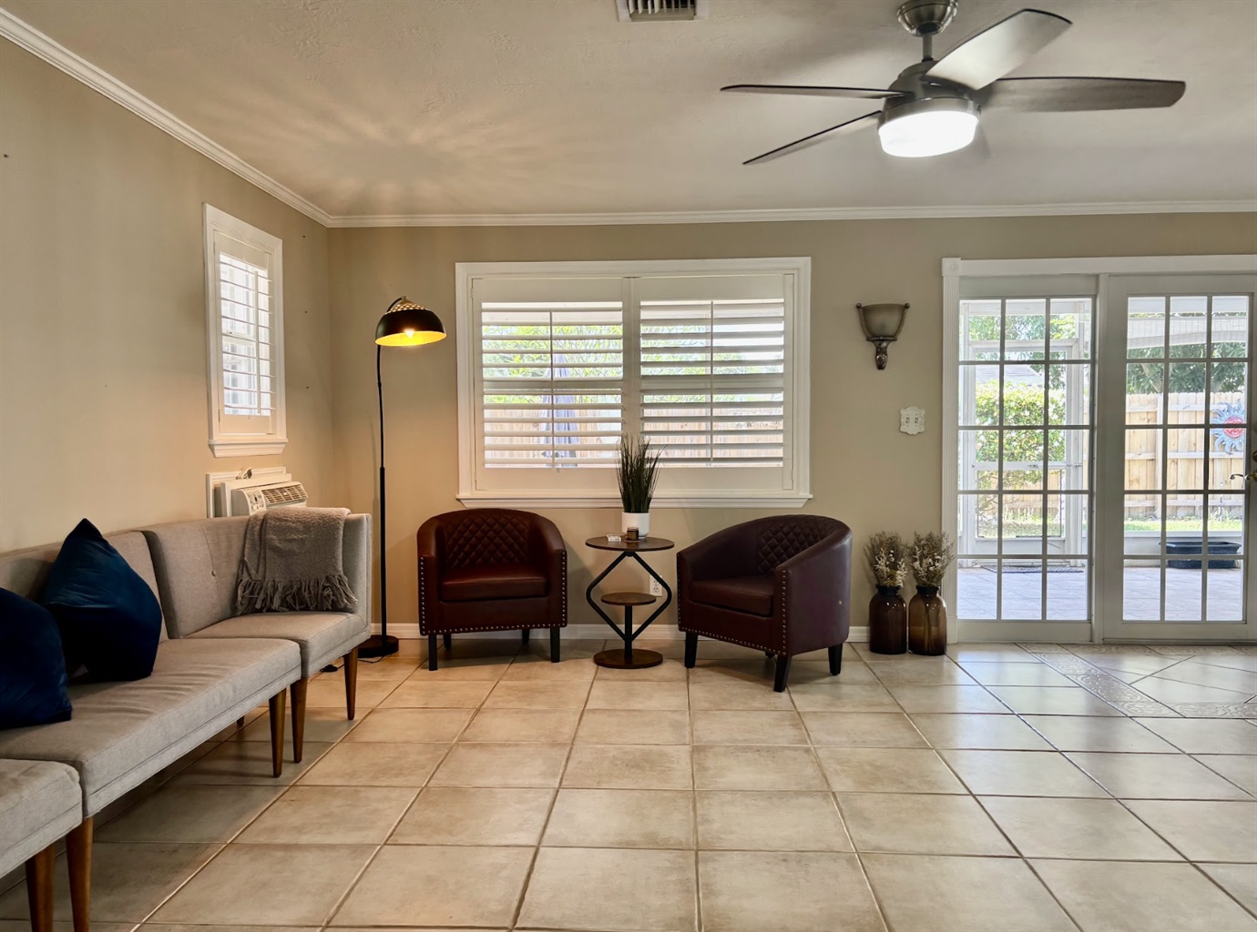 Our expansive rear living room has an abundance of seating and cozy nooks, as well as a comfortable couch with recliners.