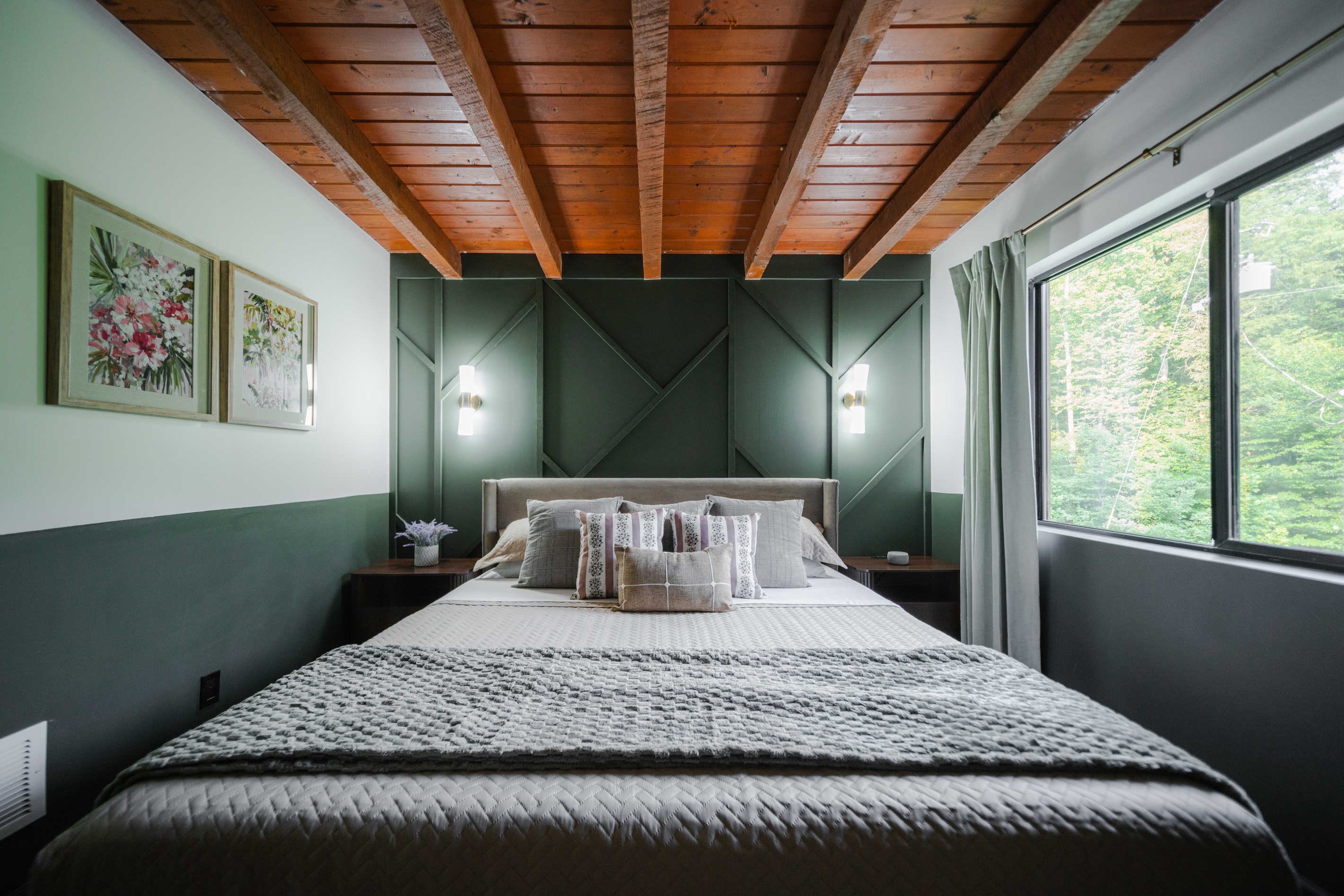 Inviting king bedroom blending cozy cabin character with elevated comfort for a restful retreat.