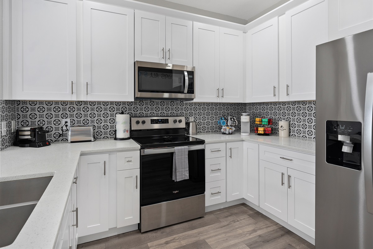 Sleek Kitchen Featuring Fresh Cabinets and New Appliances