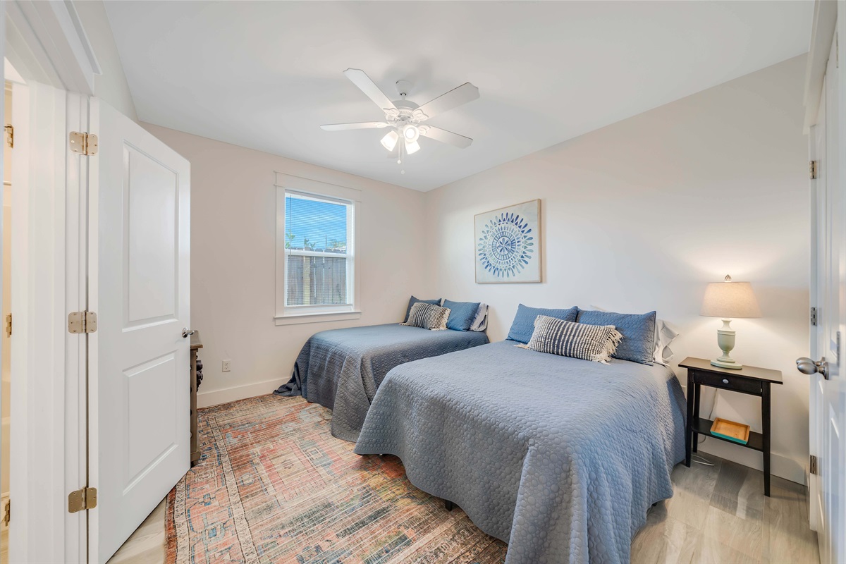 Sink into these two plush beds after a long day of travel. The window blinds help you sleep in as late as you want.