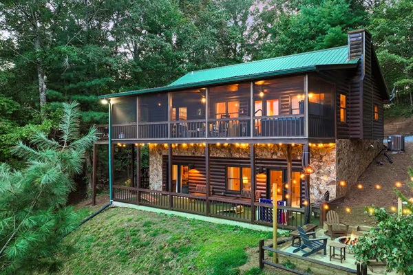 An aerial view of the back of the house reveals a spacious and inviting outdoor area, perfect for relaxation and fun. Enjoy the expansive deck, lush surroundings, and thoughtfully designed outdoor spaces.
