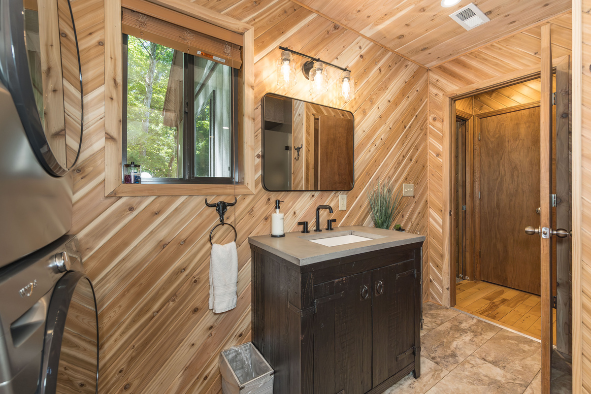 Full bathroom with walk-in shower and in-home laundry.