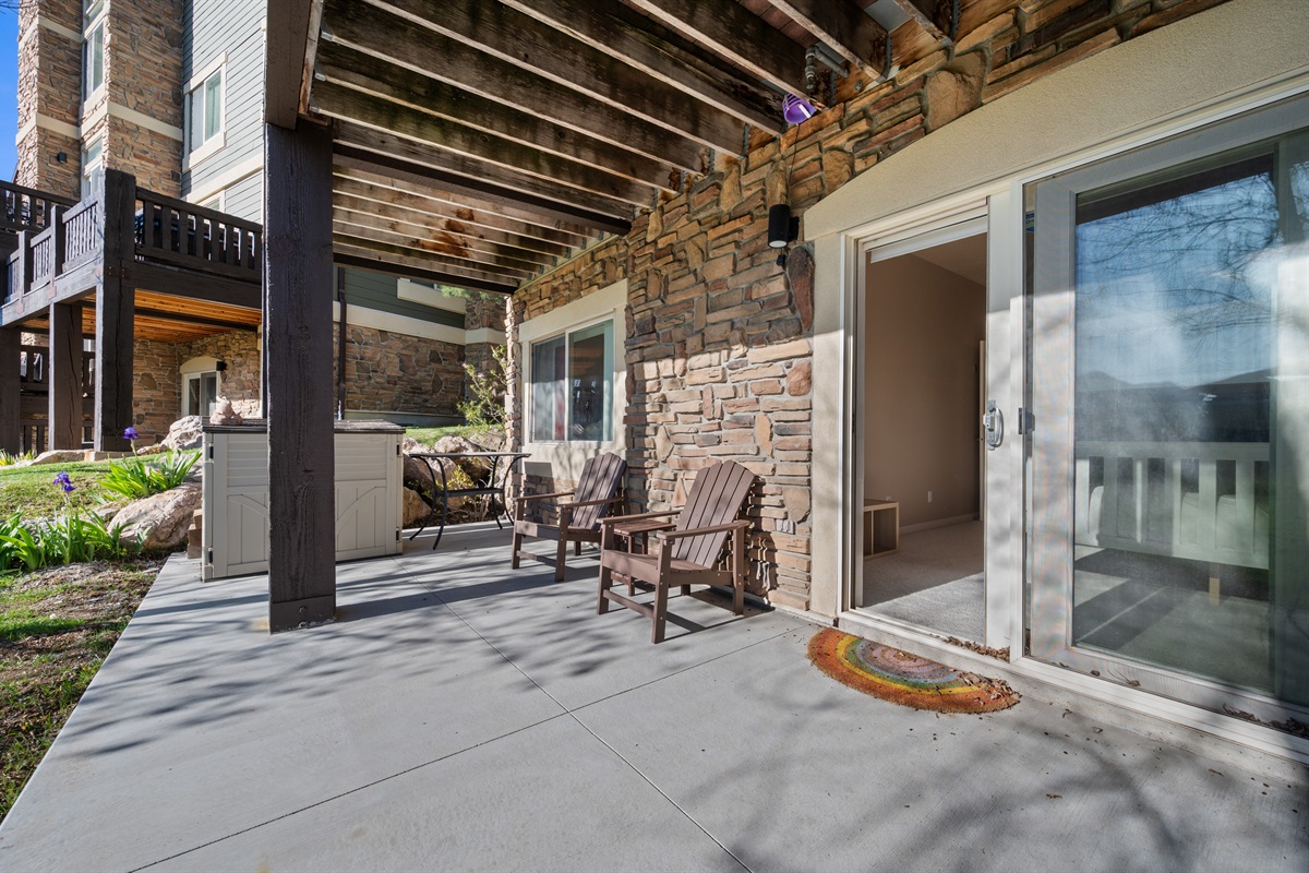 Covered patio retreat surrounded by nature—perfect for morning coffee or evening relaxation.