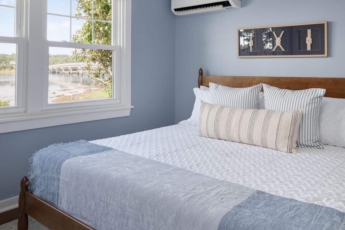  Wake up in the master as morning light hits the tidal cove — king bed, water in the windows, and nowhere you have to be for another hour.