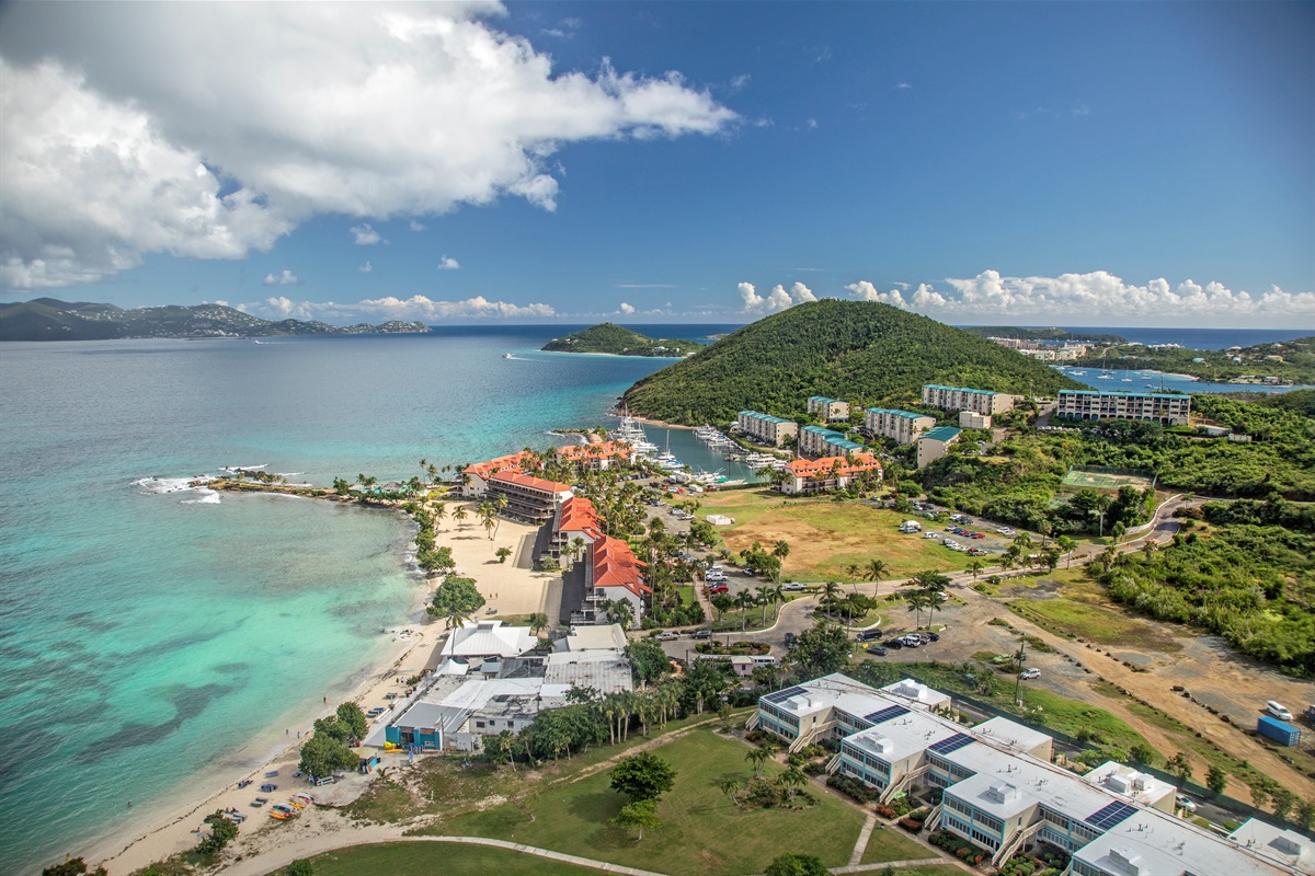 Overhead view showcasing beach, pool, and marina access.