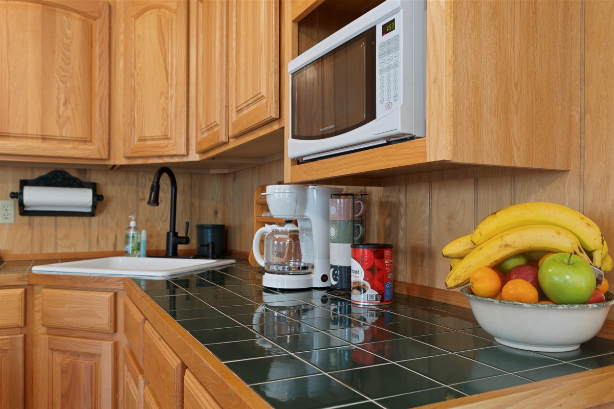Kitchen: Enjoy cooking with a bright space, modern appliances, and fresh fruit at your fingertips!