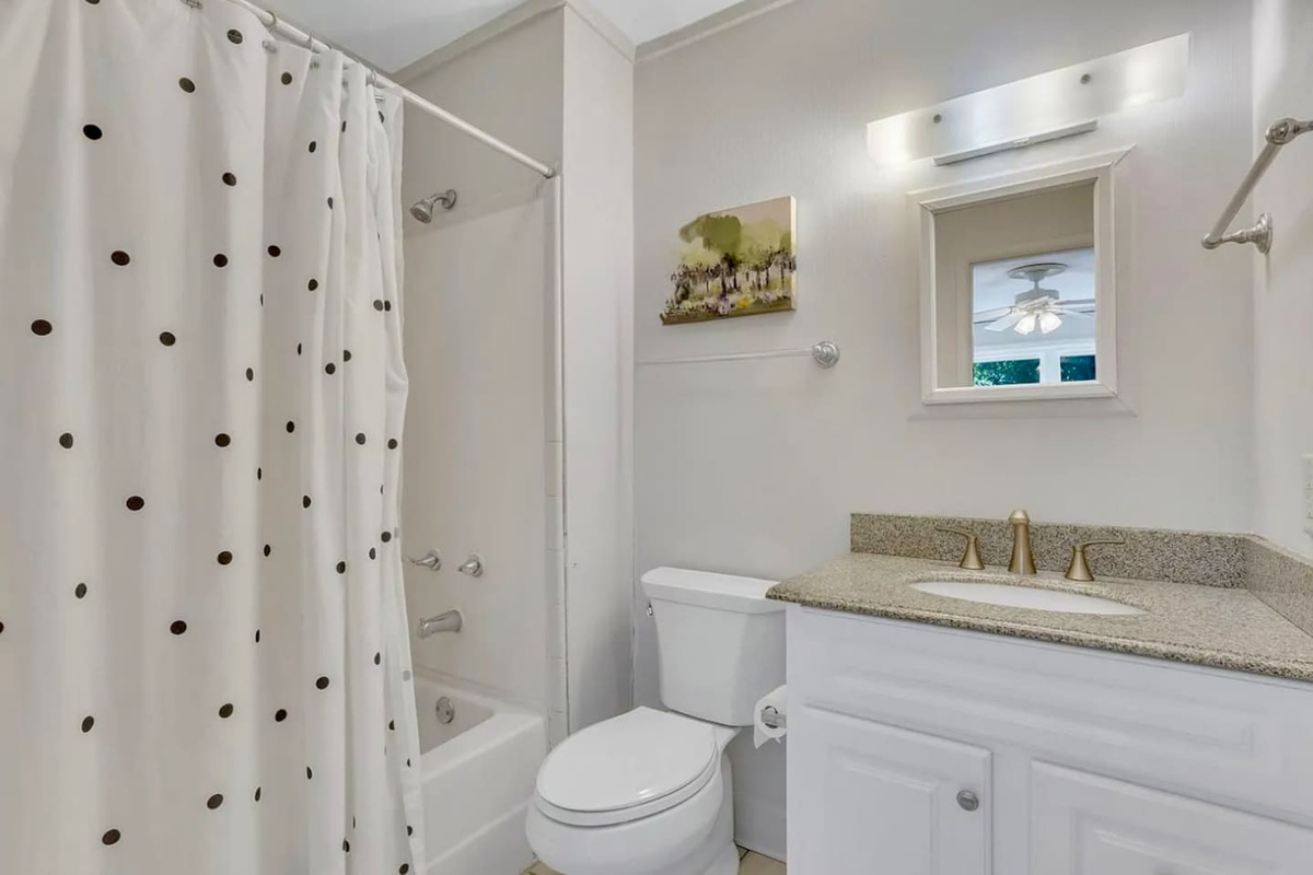 Bathroom with tub and shower