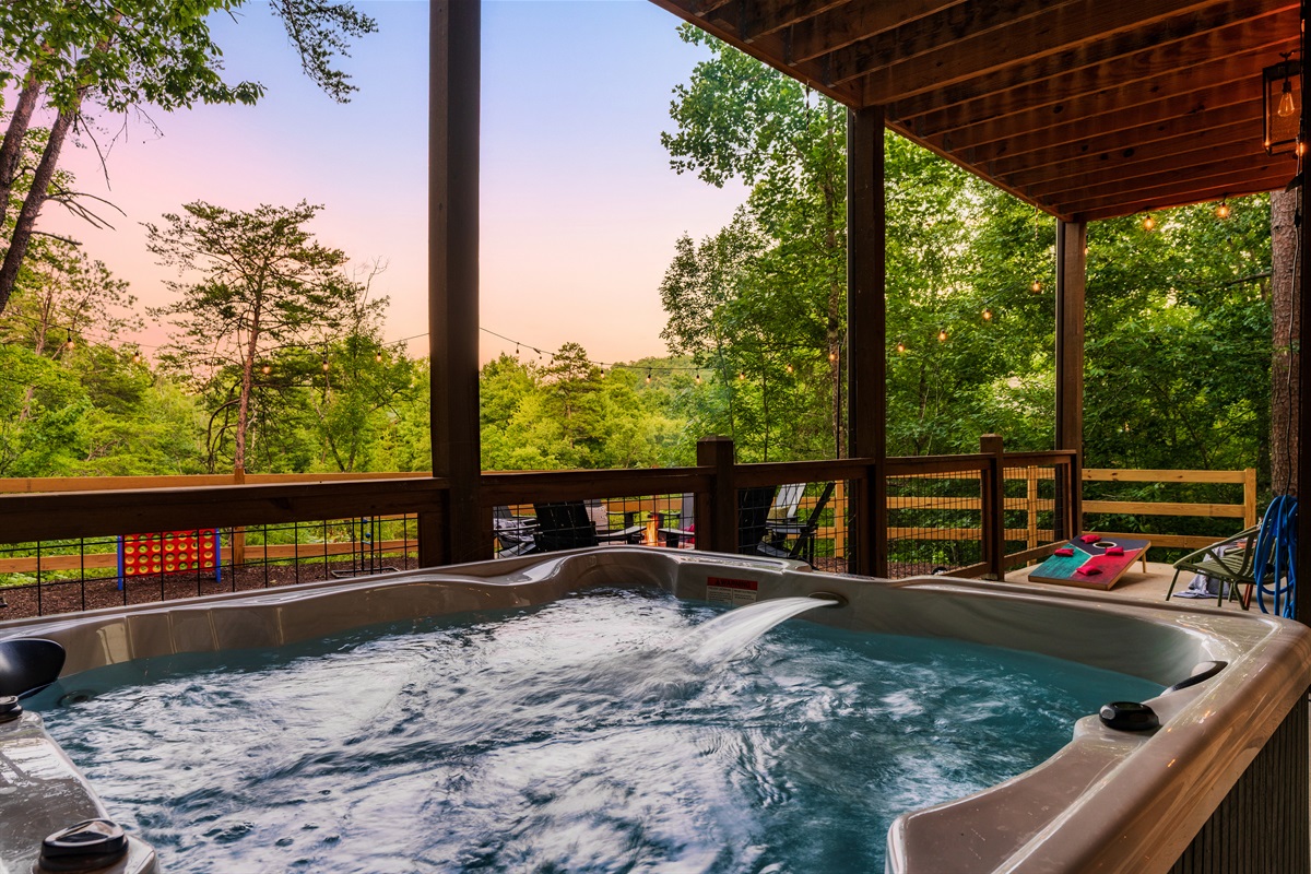 Soak in the hot tub with backyard views