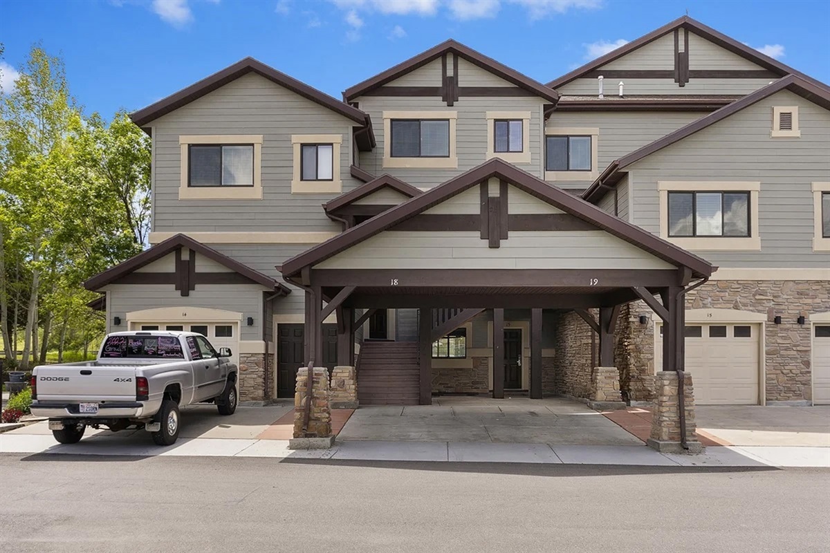 Welcoming mountain-style architecture with a covered entrance, nestled in the peaceful Lakeside Village community.
