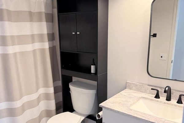 Second full bathroom offering a walk-in shower and plenty of space to get ready comfortably.