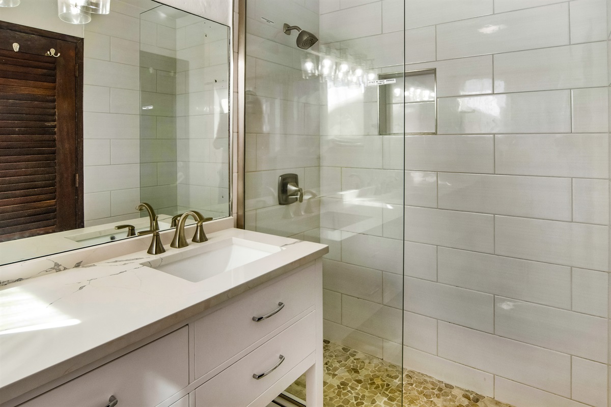 Step into a sleek, updated shower designed for a relaxing start or end to your day.