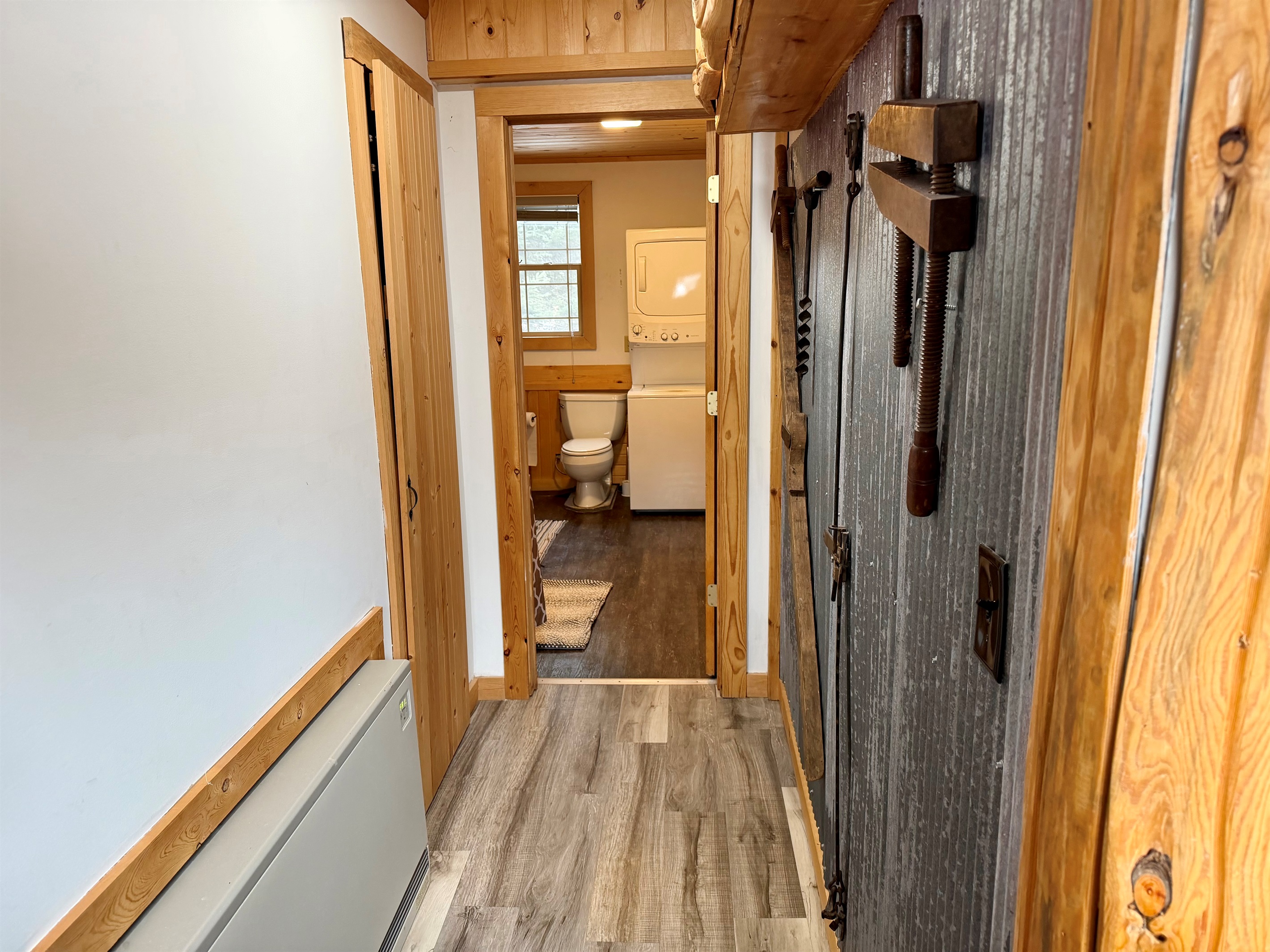 Down the hall to the bathroom room is another wall heater to keep you warm. 