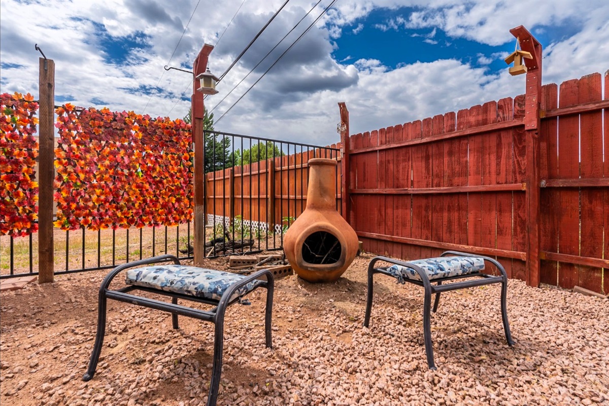 Enjoy the inviting backyard with chiminea for cozy, memorable nights.