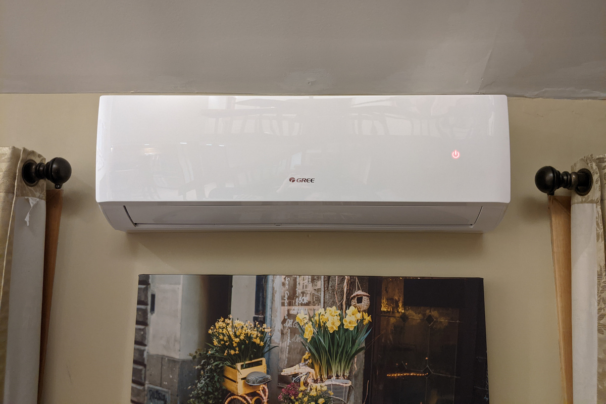 Living room split unit providing heat and air conditioning for comfort