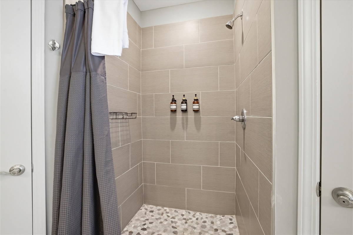 Take your time in this walk-in shower—simple, spacious, and set up for a full reset. Unit 2 keeps everything easy and exactly where you expect it.