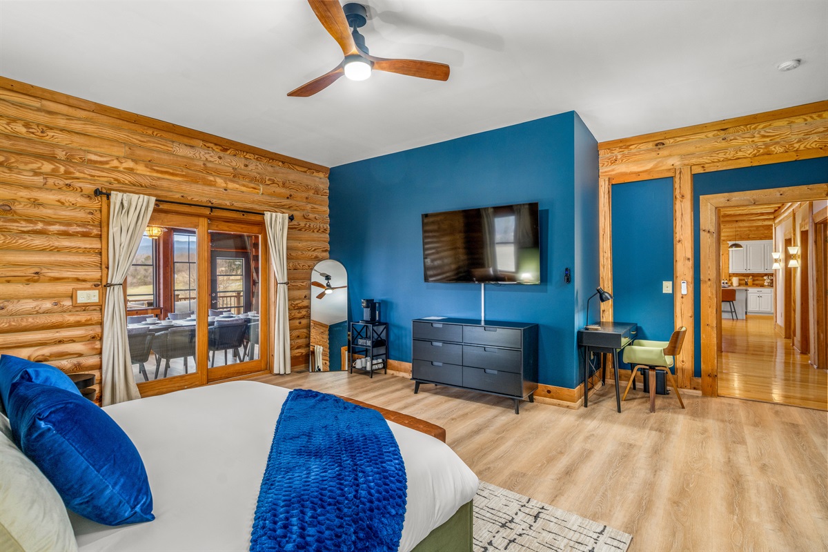 Comfortable bedroom with entertainment and space to unwind.
