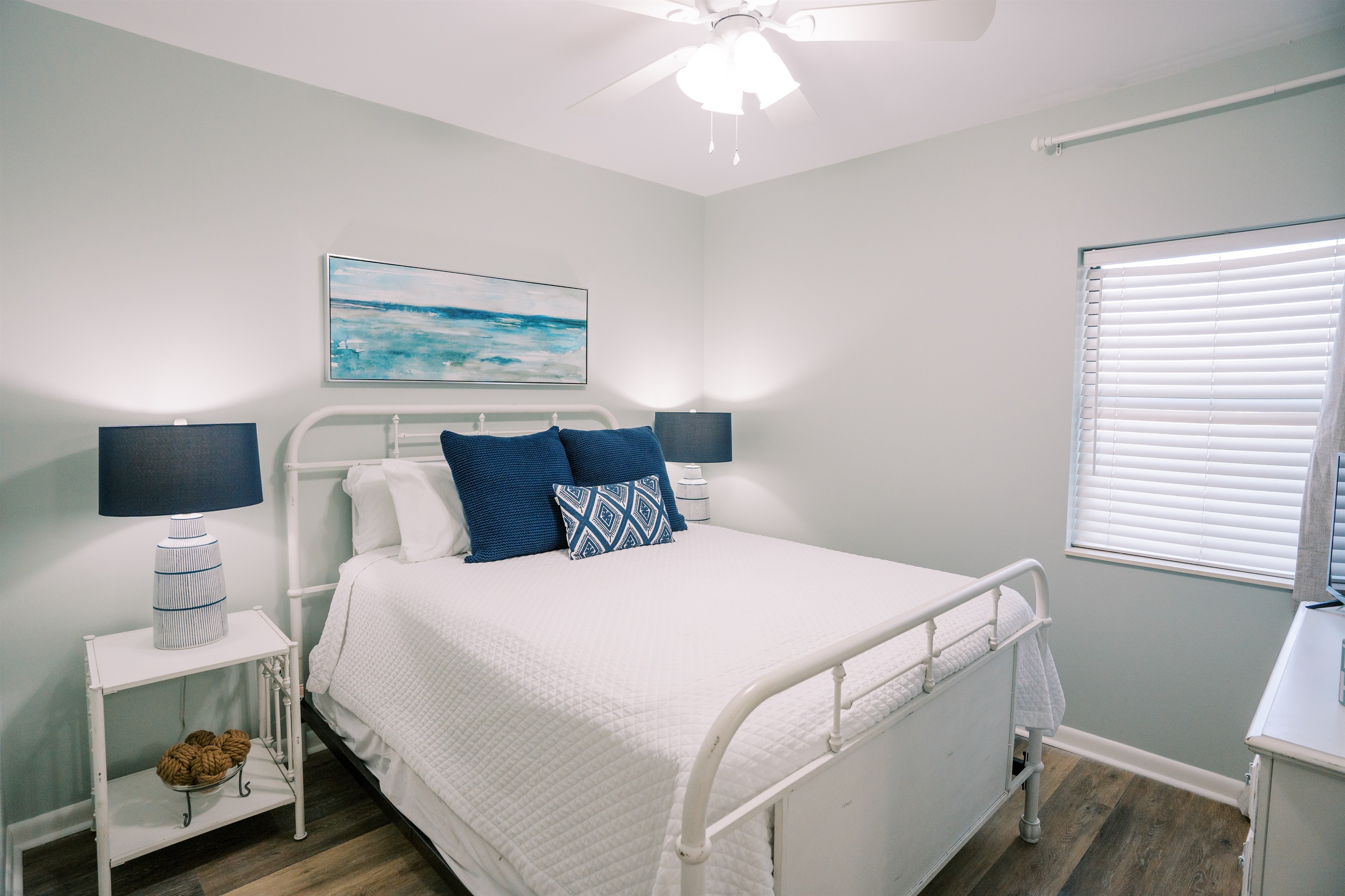 Comfortable queen bedroom with a clean, coastal feel and plenty of space to settle in.