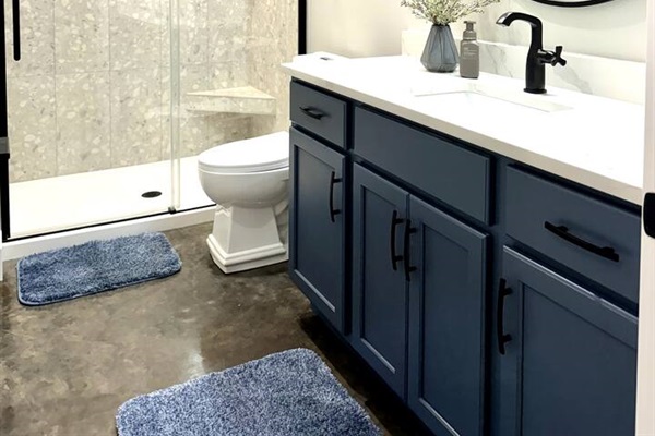 Beautifully tiled and tastefully decorated bathroom for a serene bathroom experience. 