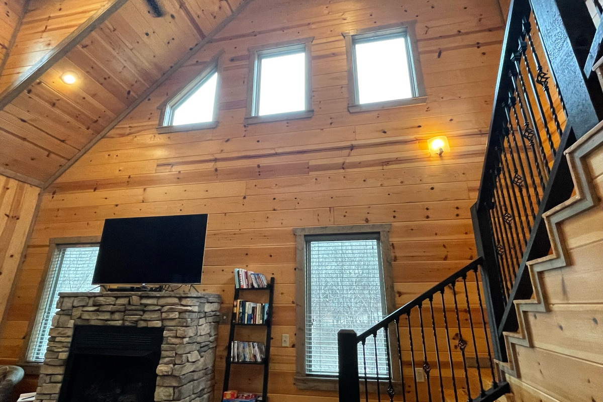 The living room with many high windows for excellent light.