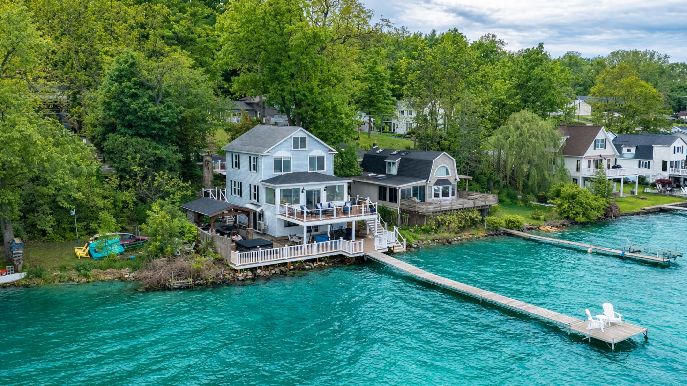 Stunning lakefront home with multi-level decks and a private dock—perfect for sunrise coffees and sunset cocktails 🌅🏡🚤