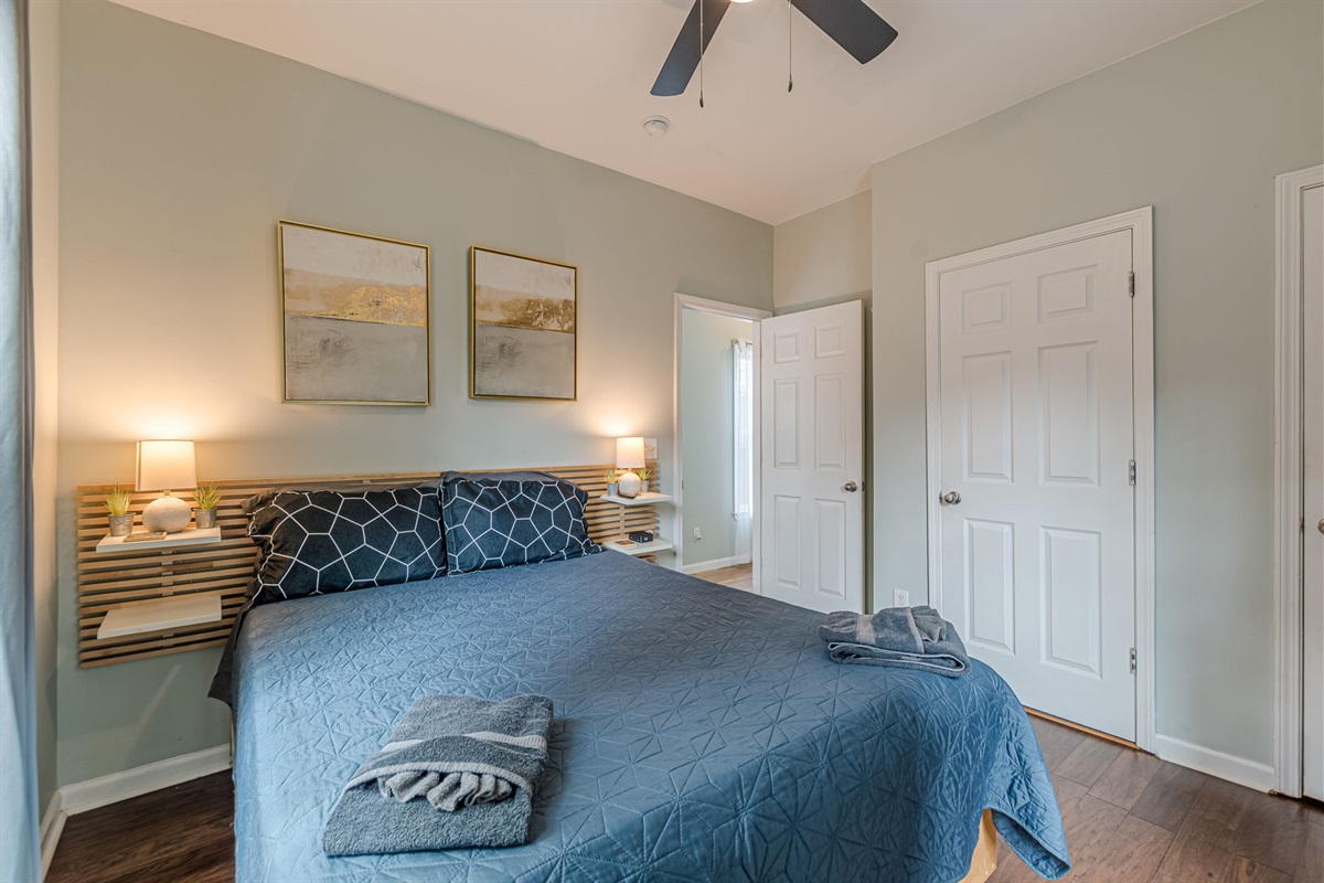 Cozy queen bedroom downstairs—perfect for guests seeking comfort and privacy.