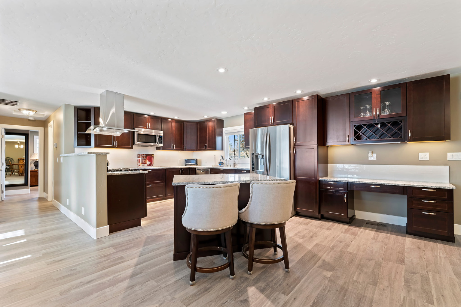 Fully upgraded kitchen featuring an open-concept design, making it easy for guests to move around and gather comfortably.