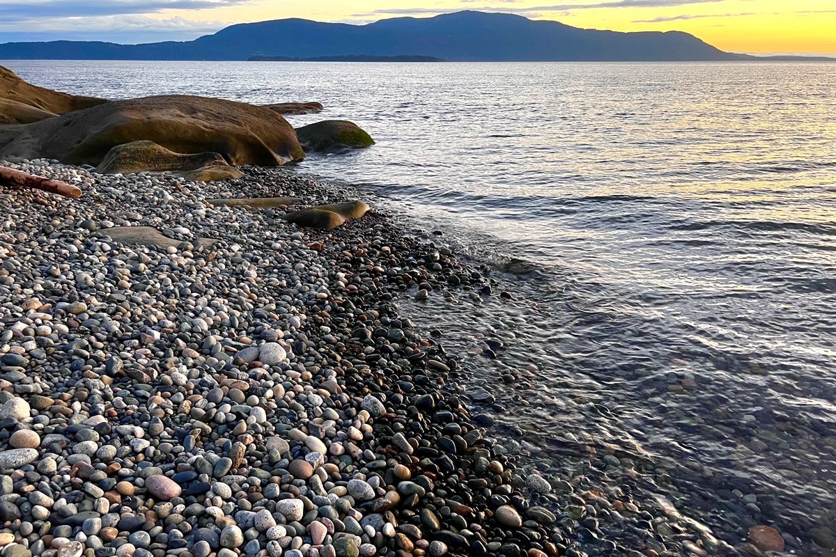Sink into the sand at Sunset Beach - just a short drive from Driftwood Dreams. Lean against a piece of driftwood, watch the sun drop behind the islands, and stay until the light is gone. 