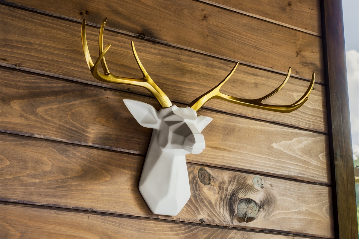 Rustic cabin vibes with a modern touch – unique deer wall art adding charm to your cozy stay