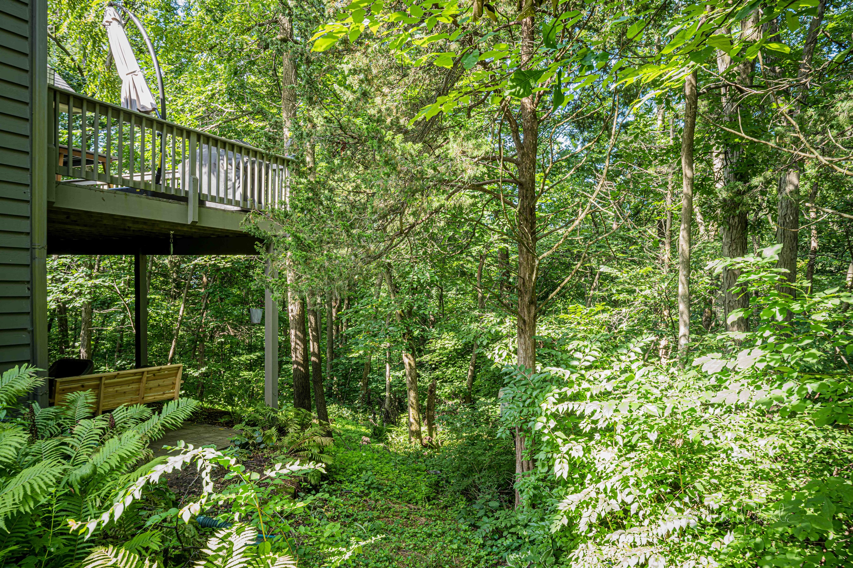 On over an acre of beautiful, peaceful woods