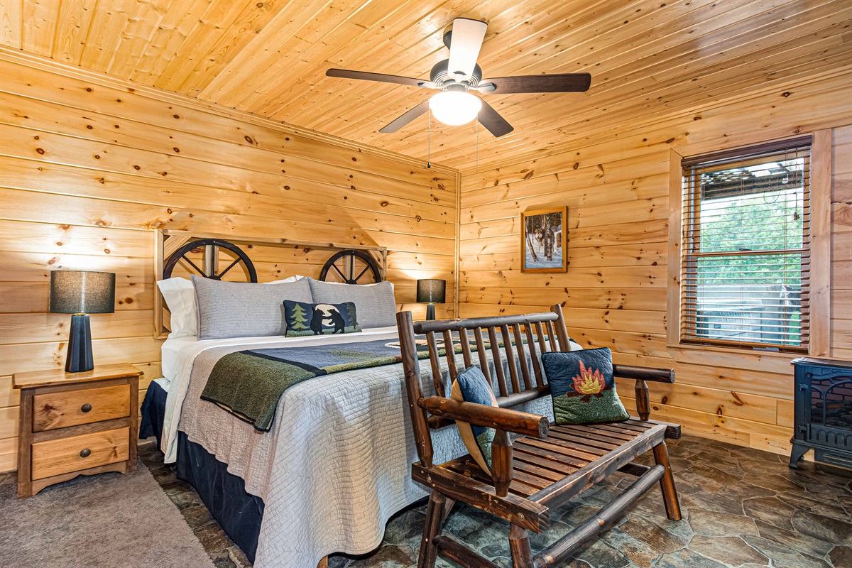 Imagine yourself snuggling up on this cozy bench, enjoying the warmth of the campfire-themed pillows after a day of exploring.
