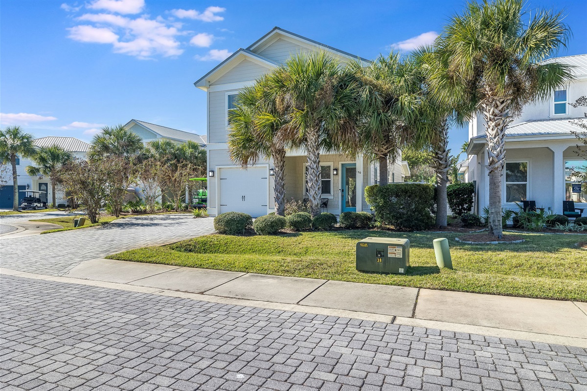 Quiet, palm-lined neighborhood with sidewalks and coastal charm.