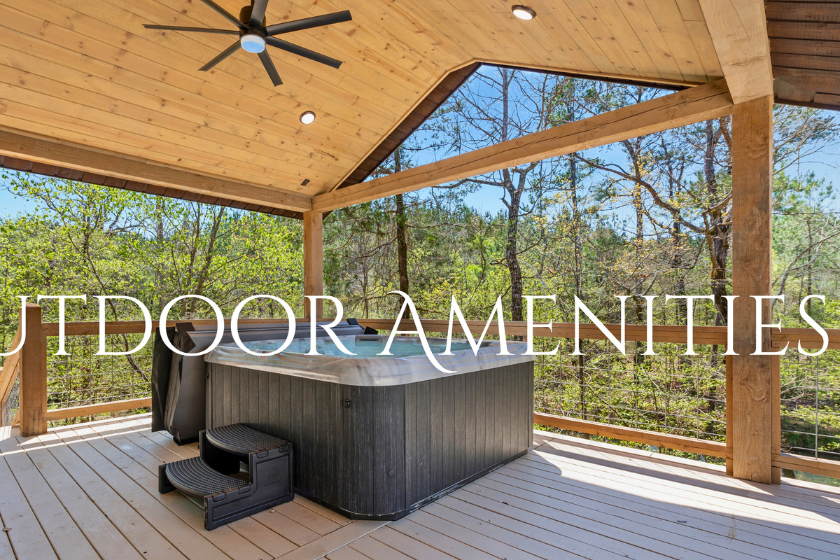 Enjoy the great outdoors with these covered amenities that include a luxurious hot tub set on a spacious deck surrounded by tranquil forest views.