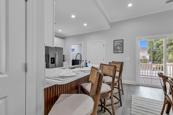 With a generously sized dining table seating 8 and additional seating for 4 at the island, there's room for everyone to come together. Enjoy shared meals and conversations in this welcoming sp