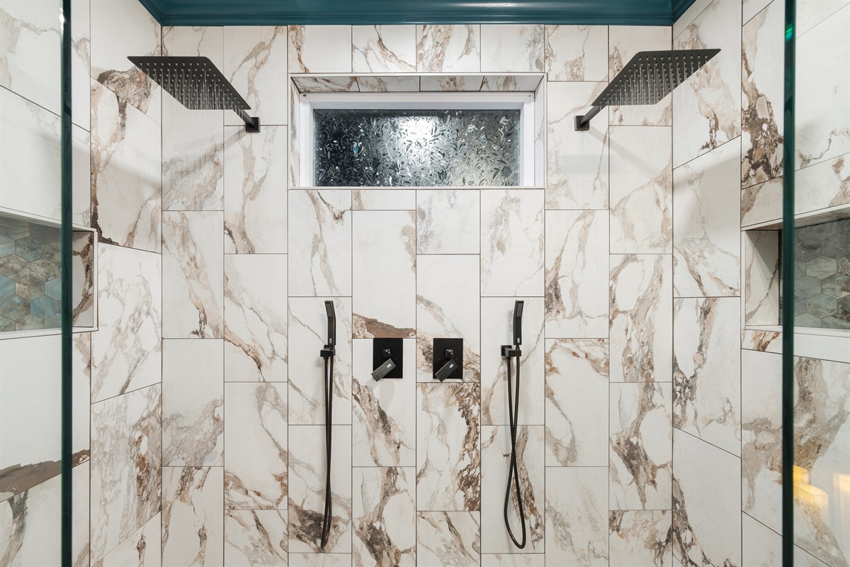 Enjoy the ultimate rejuvenation experience in the custom double rainfall walk-in shower.