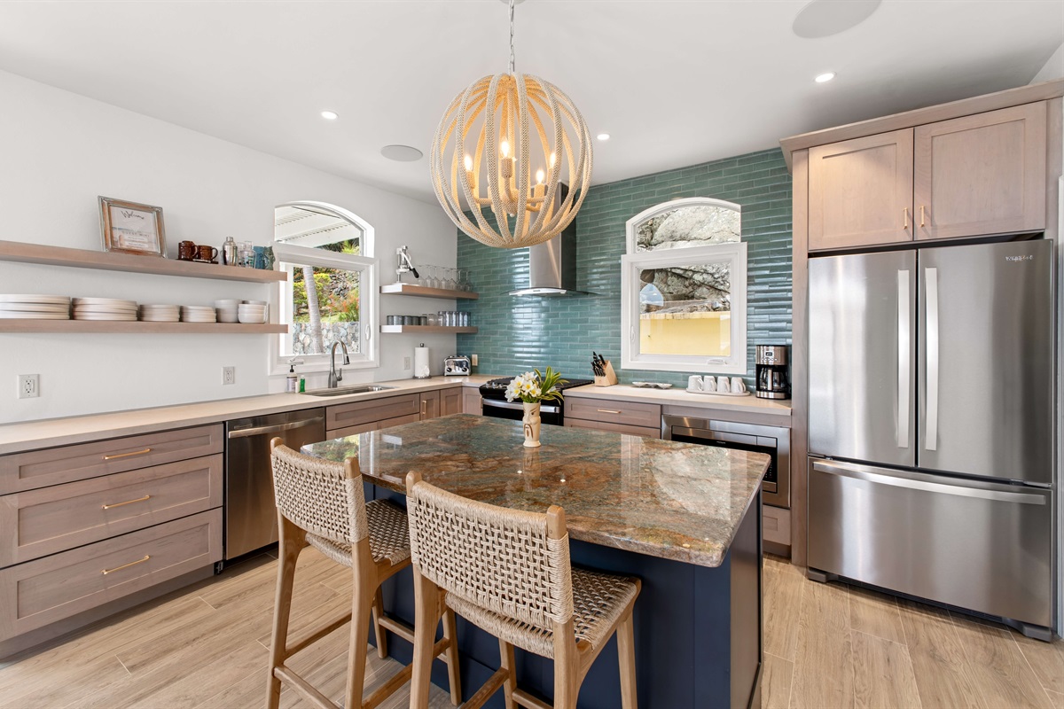 Fully stocked kitchen with stainless appliances, bar seating, coffee maker, blender, and all the tools to cook or sip in style. Enjoy free Wi-Fi throughout the villa.