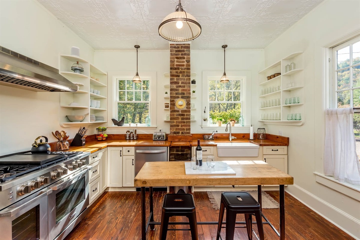 Light and Airy Kitchen with beautiful stainless appliances, and room for other guest to join the chef for conversation and cocktails. 