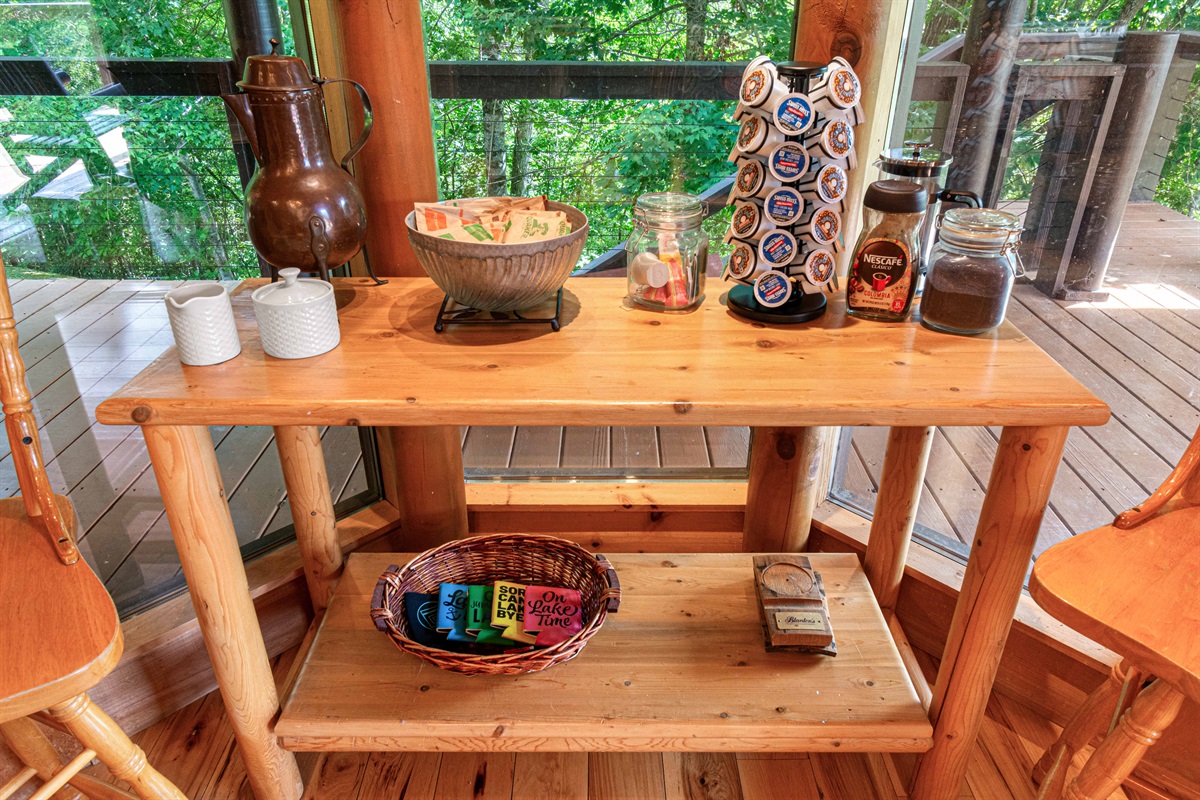 Main Level Kitchen: Sip coffee while enjoying views of nature from this charming little corner!