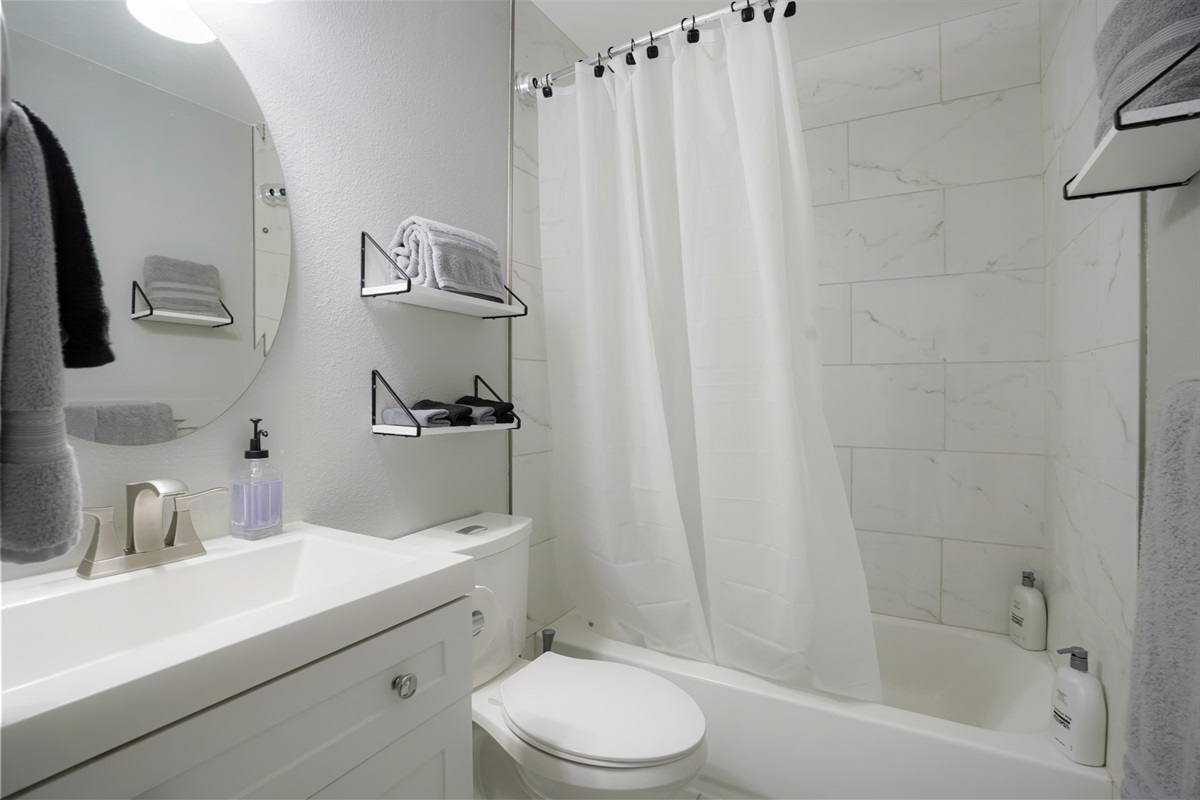 Full bathroom equipped with a tub and shower.