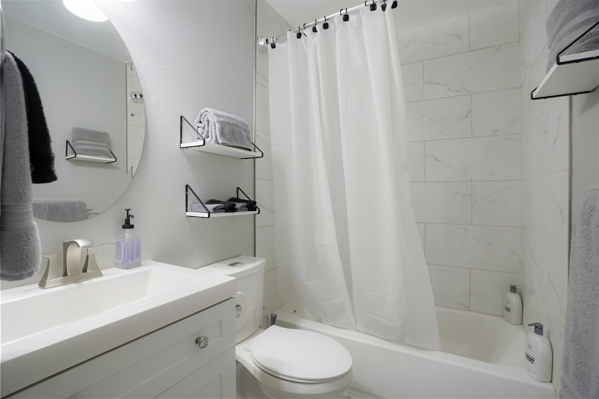 Full bathroom equipped with a tub and shower.