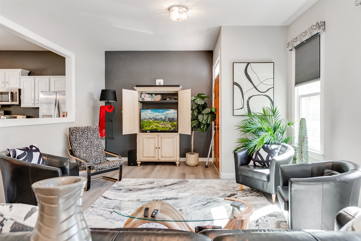 Living Room: Sleek design meets relaxation with chic seating and vibrant greenery! Perfect for gatherings!