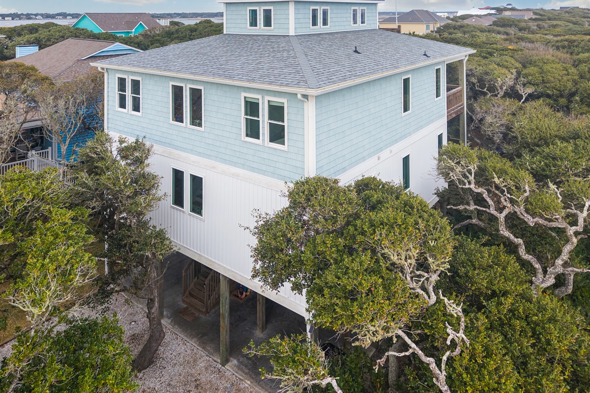 Your private beach escape, shaded by majestic oaks