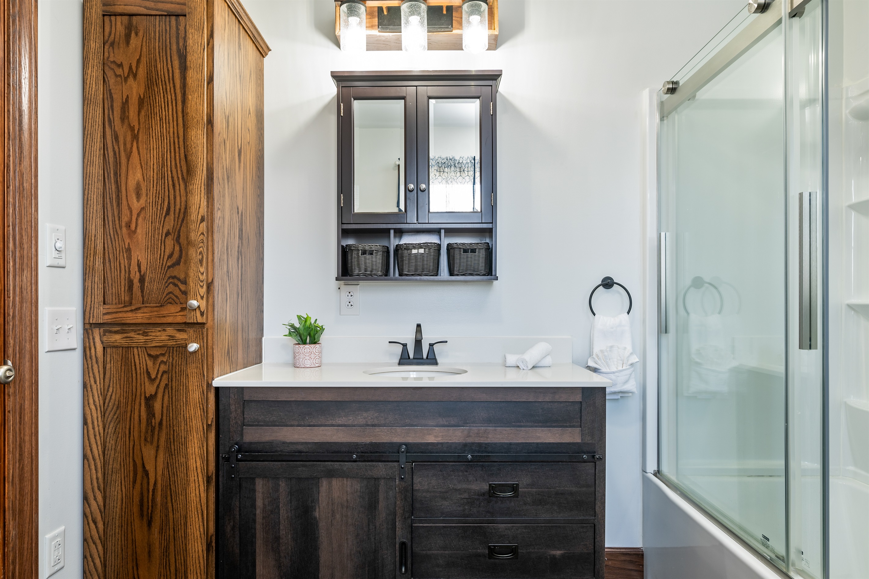 Contemporary bathroom with sleek vanity and glass shower—spa-inspired comfort.