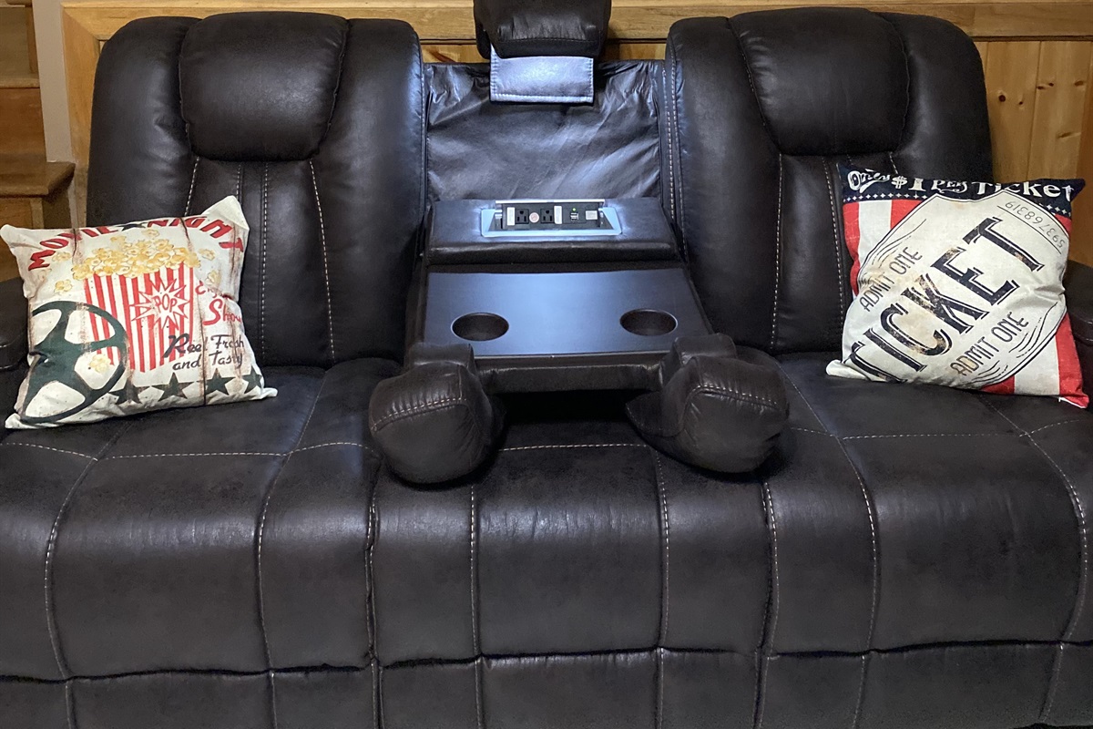 Reclining sofa with cup holders, reading light, and connectors to charge your devices